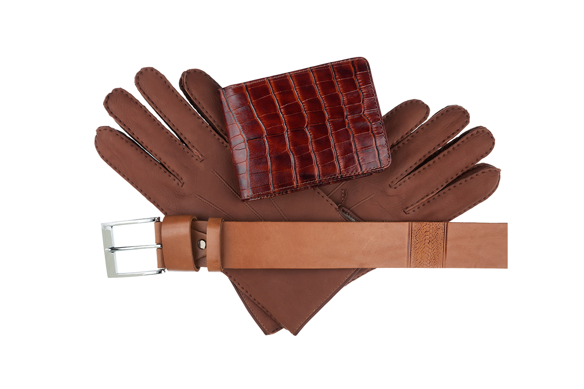 A wallet, belt and pair of gloves