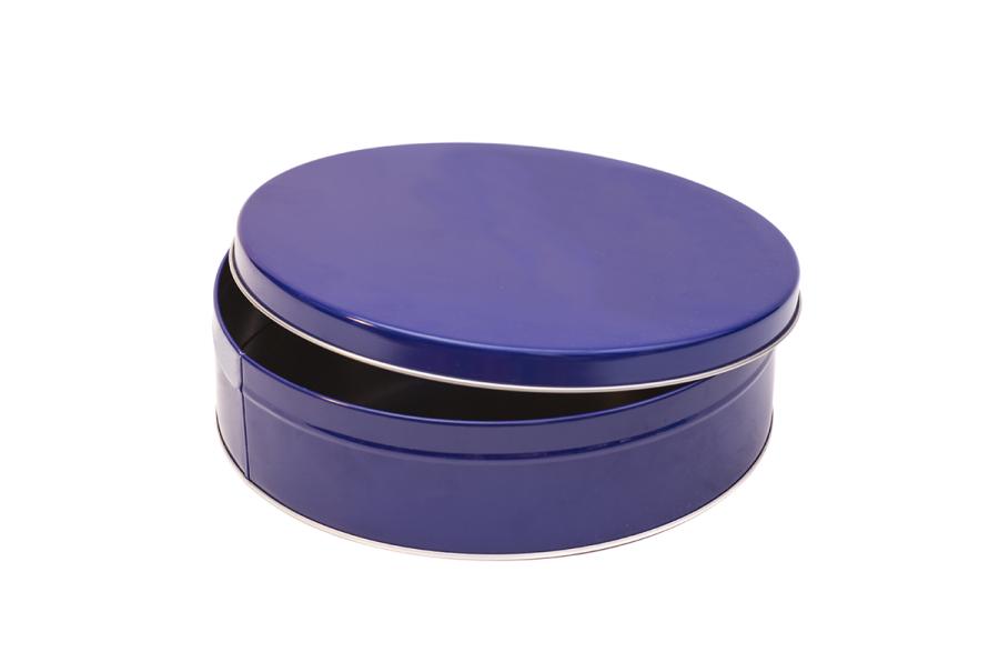 A round blue holiday tin
